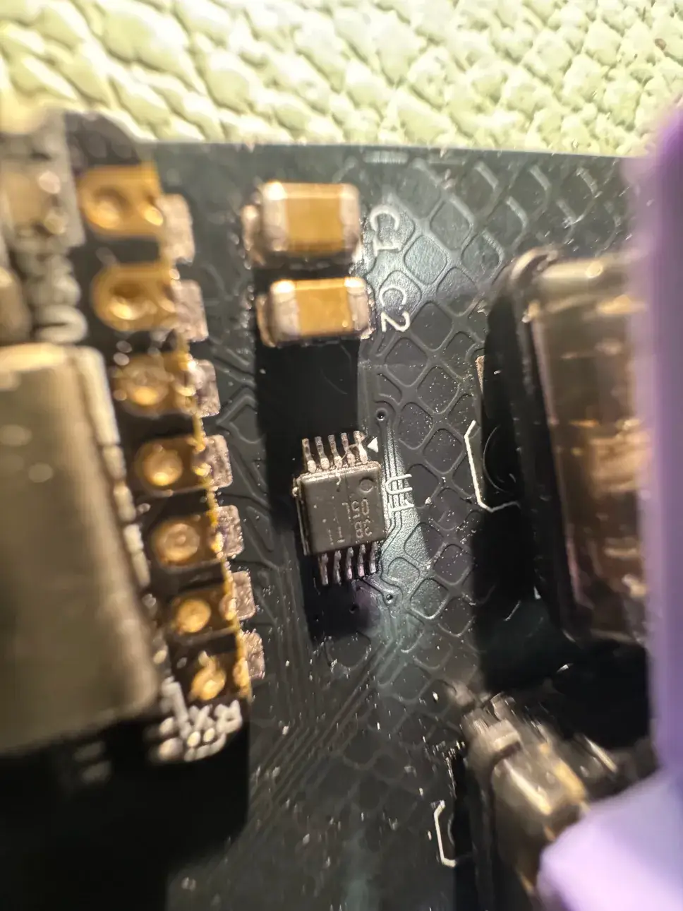 Circuit board closeup showing DRV2605L haptic driver IC.